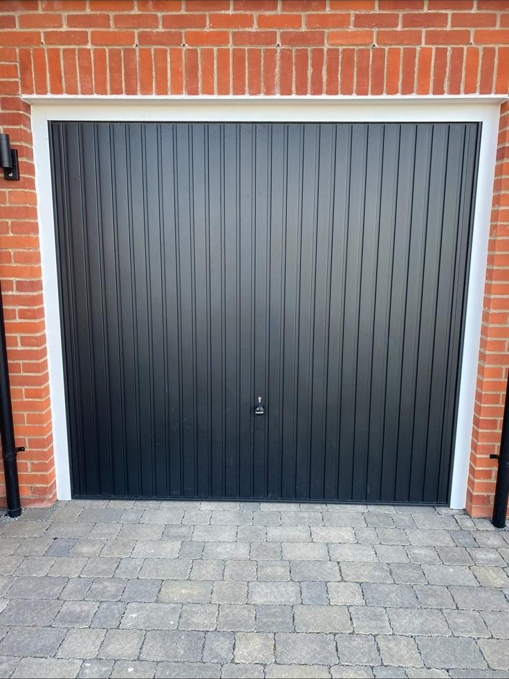 Single garage with a new anthracite door and matching frame