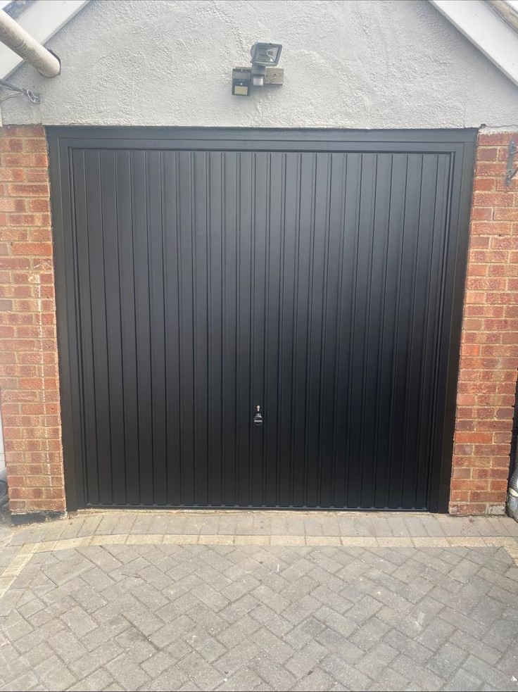 Single garage with the original vertical-panel door